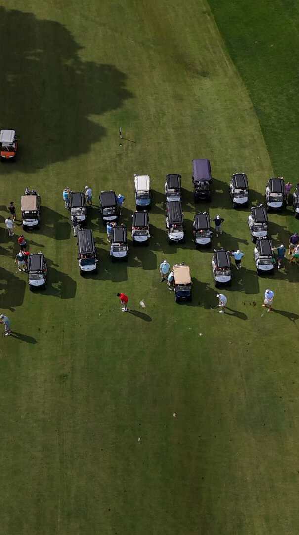 Aerial view of golf carts on a golf course