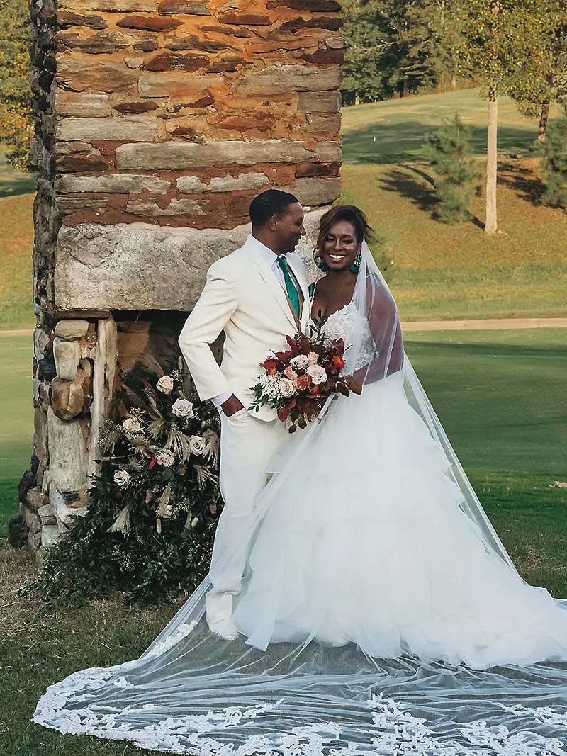 Wedding couple standing in front of a chimney